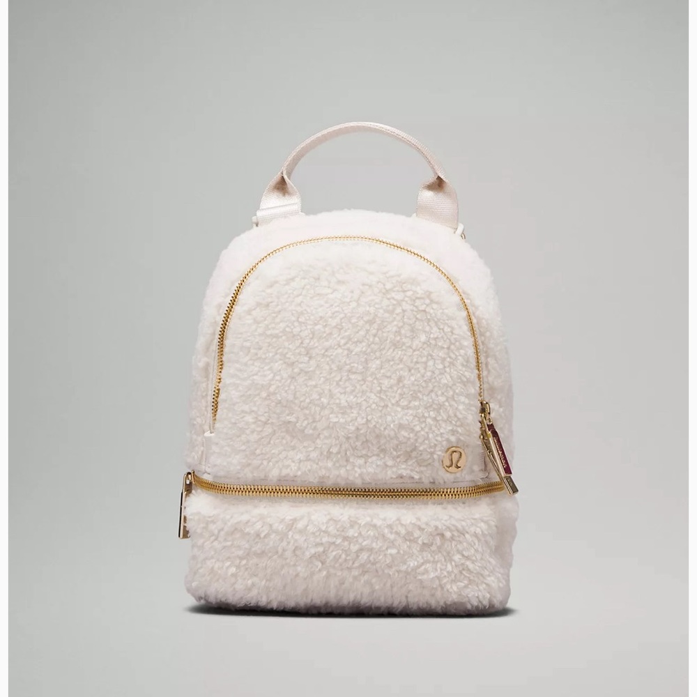 City Adventurer Backpack Micro *Fleec:
LW9EQWS
ONE SIZE whto/gold